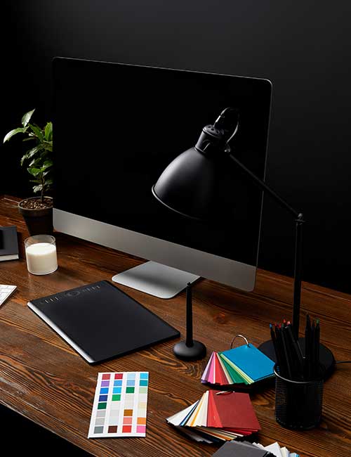 A professional and modern desk setup representing a digital marketer's workspace. The image symbolizes a strategic and organized approach to planning and executing digital marketing campaigns.